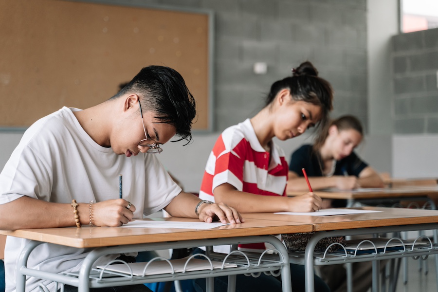 Student taking an AP exam in a high school classroom