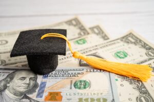 Graduation gap hat on US dollar banknotes