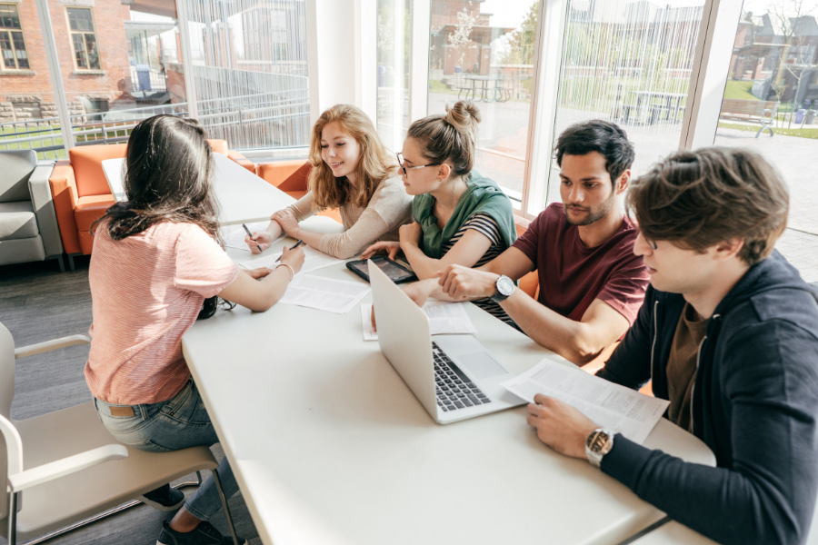 Group of international students collaborating on a project, highlighting the benefits of the Assist Scholars Exchange Program for global education experiences.